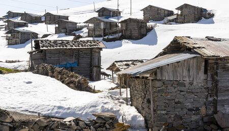 Koprulu, Turkey - May 9, 2019: Small village of Koprulu in the snow with wooden houses and cabins in a snowy valley in Turkey.のeditorial素材