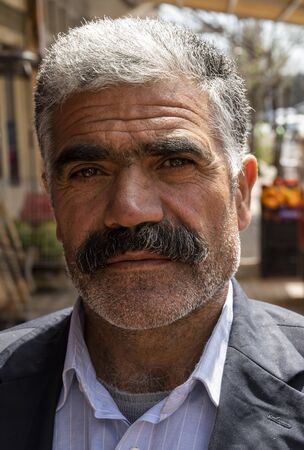 Susuz, Turkey - May 9, 2019: Turkish man with hat, moustache and beard in a turkish cafe.のeditorial素材