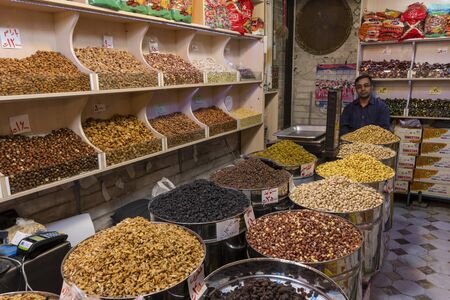 Tabriz, Iran - May 12, 2019: Great Bazaar in Tabriz with man in a nuts shop at the market, Iran.のeditorial素材