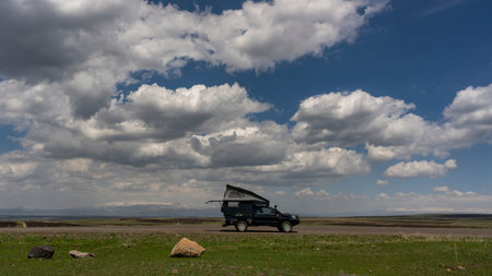 Yalinkaya, Turkey - May 9, 2019:  4x4 Toyota camper car on the road in Turkey with snowy mountains...