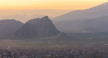 Dogubeyazit, Turkey - May 10, 2019: Evening in and overview over Dogubeyazit with mountains in the background, Turkey.のeditorial素材