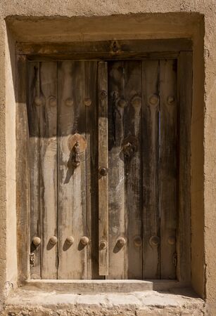 Damghan, Iran - May 25, 2019: Door  with male and female door knocker of the oldest mosque, the Tarikhaneh Mosque in Iran.のeditorial素材