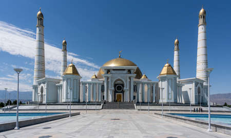 Ashgabat, Turkmenistan - June 1, 2019: The Mosque near masoleum of Turkmenbasy, the president Niazov, in the white and marble city of Asjchabad with great buildings and landmarks in Turkmenistan.のeditorial素材