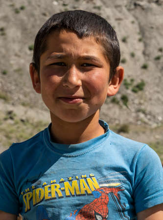 Iskanderkul, Tadzjikistan - June 13, 2019: Portrait of a child near Iskanderkul in Tadzjikistan.のeditorial素材