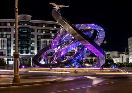 Asjchabad, Turkmenistan - June 1, 2019: The white and marble city of Asjchabad with great buildings, statue at night in Turkmenistan.のeditorial素材