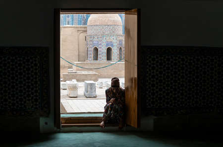 Samarqand, Uzbekistan - June 9, 2019: Woman at Shah i Zinda graveyard with mausoleum in Samarqand in Uzbekistan.のeditorial素材