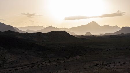 The mountains near Damghan with dry valley during sunset, Iran.