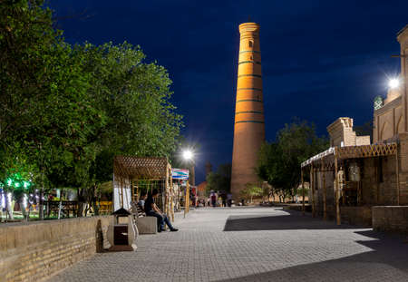 Khiva, Uzbekistan - June 5, 2019: Evening in  Itchan Kala with people in the old city centre of Khiva in Uzbekistan.のeditorial素材