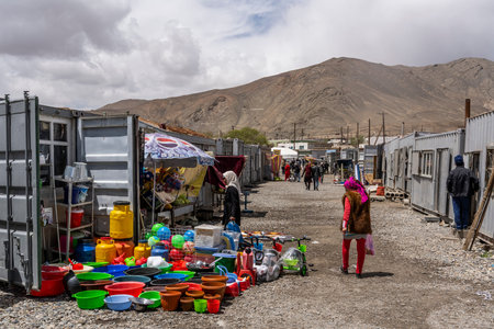 Murghab, Tajikistan - June 25, 2019: The market with container shops and  people in Murghab, Tajikistan at the Pamir Highway.のeditorial素材