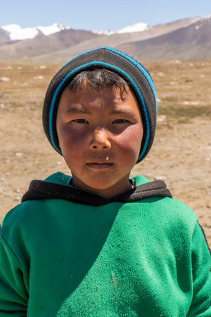 Jeti-Oguz, kyrgystan - July 11, 2019: Small boy in the Mountains of Kyrgystan in summertime with...