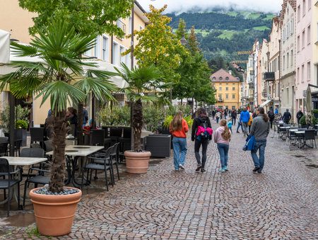 Brixen, Italy - October 4, 2020: the city of Brixen with terrace and shopping people in autumn.のeditorial素材