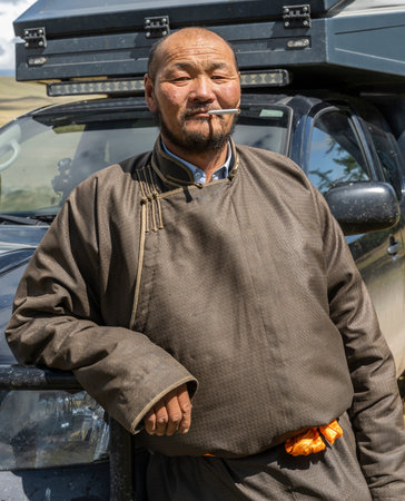 Tsagaan-Uul, Mongolia - August 11, 2019: Portrait of a Mongolian man in traditional clothes with...