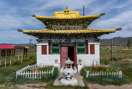MÃ¶rÃ¶n, Mongolia - August 17, 2019: White stone Buddhist temple with yellow roof and statues in MÃ¶rÃ¶n, Mongolia.のeditorial素材