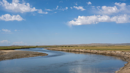 River near Ogii Lake in Mongolia in summer with blue sky and white clouds.の写真素材