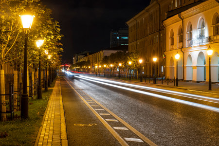 Kazan, Russia - September 21, 2019: Kremlyovskaya Street at  night with cars in the street and many...