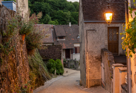 Gargilesse-Dampierre, France - June 14, 2022: Street with cat in the evening in the small village Gargilesse, one of the Plus Beaux Villages de France.のeditorial素材