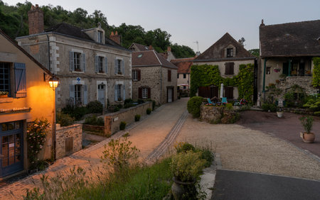 Gargilesse-Dampierre, France - June 14, 2022: Street, terrace and small street in the evening in the small village Gargilesse, one of the Plus Beaux Villages de France.のeditorial素材
