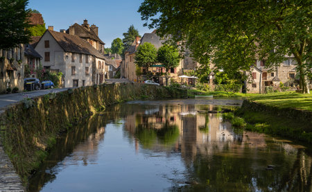 Segur-le-Chateau, France - June13, 2022: The river L'Auvezere streaming near the village of Segur-le-Chateau one of the 'Les Plus Beaux Villages de France'.のeditorial素材