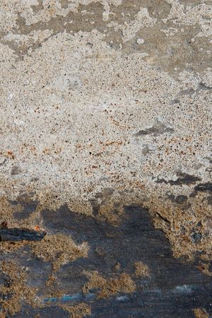 Grungy black and white textured background with black along bottomの写真素材