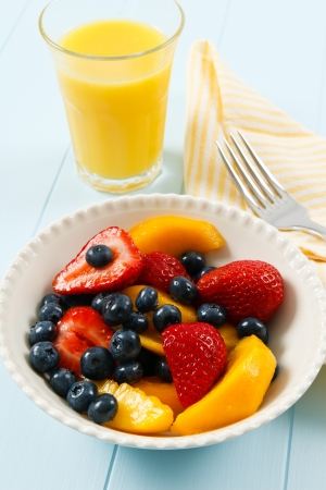 A healthy fresh fruit salad with strawberries, blueberries and nectarines is a delicious summer breakfast.の写真素材