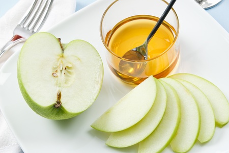 Apples and Honey are traditional symbols shared at Rosh Hashanah celebrationsの写真素材