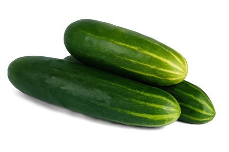 Stack of three fresh green cucumbers on a white background with shadow show a healthy vegetarian foodの写真素材