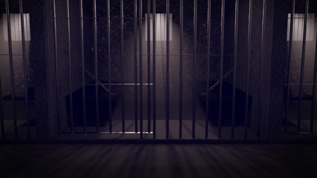 A corridor in a prison at night showing jail cells.の写真素材