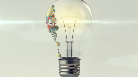 An arty 3d rendering of a transparent glass ligh bulb with a a lit metallic wire and small multicolored and striped balls in it. They are placed in the left part of a lamp in the grey background. の写真素材
