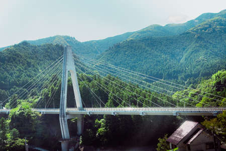Beautiful view of the cable-stayed bridge in the mountainsの写真素材