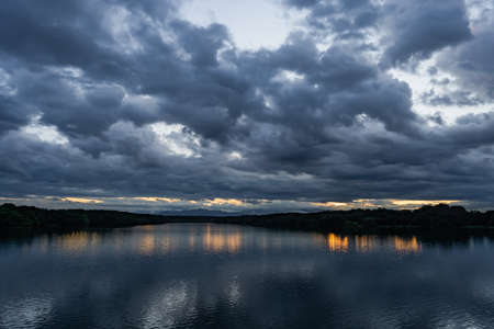 Cloudy Weather with Sunrise | Horizon lake | The Shadow Of The Clouds On The Water | Brighter Colours | No People Japan lakeの写真素材