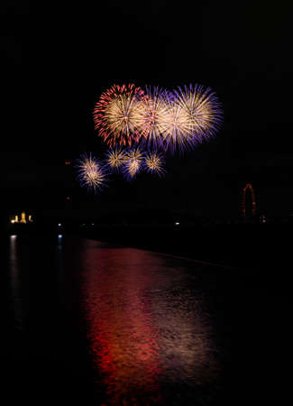 Beautiful Fireworks Celebration In Japan | Summer Season Night Festival | Near The Lake | No People | Firework With Colourful Shadowの写真素材