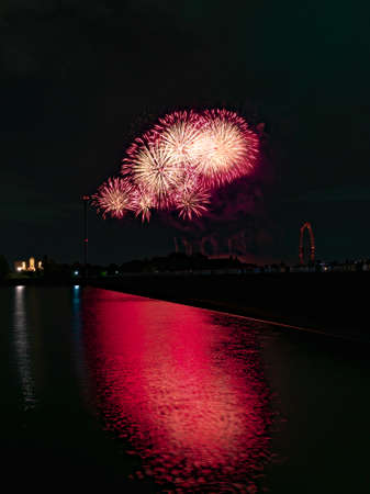 Beautiful Fireworks Celebration In Japan | Summer Season Night Festival | Near The Lake | No People | Firework With Colourful Shadowの写真素材