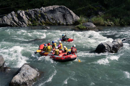 Okutama, Saitama  Japan - 08 26 2021: Dangerous place rafting with team work in safetyのeditorial素材