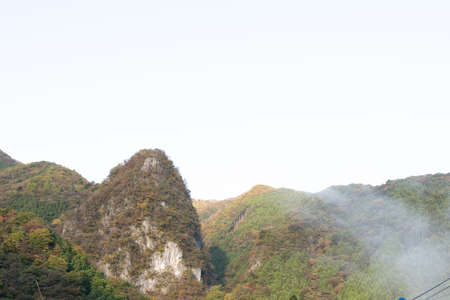 misty with morning mountain colourful autumn.landscape scene Okutama Japan.の写真素材