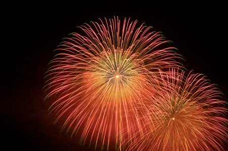 Colorful fireworks of various colors over night sky, celebration and anniversary conceptの写真素材