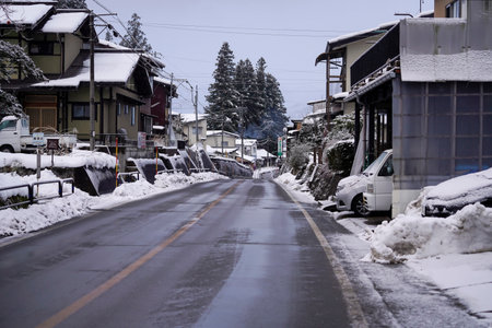 Snowy street in the old town of Carlsbad, Japan. A beautiful shot of a road leading through snowy trees in the Black Forest mountains of Japan alps.のeditorial素材