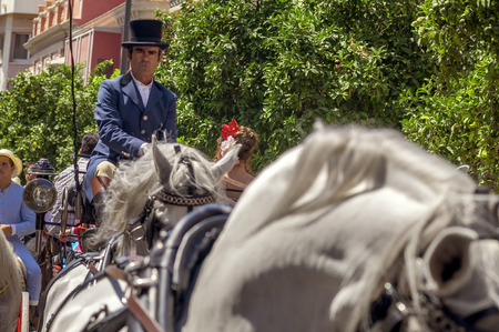 MALAGA, SPAIN - AUGUST, 14: Horsemen and carriages at the Malaga August Fair on August, 14, 2009 in Malaga, Spain のeditorial素材