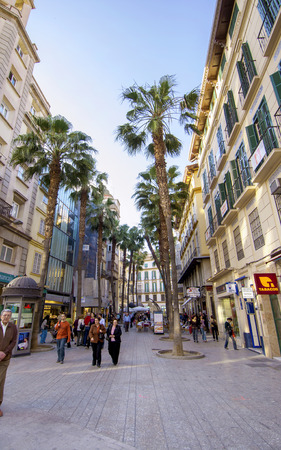 MALAGA - JUNE 12: City street view with cafeteria terraces and shops on June 12, 2013 in Malaga, Spain. のeditorial素材