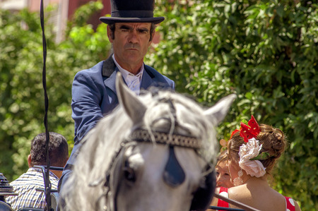 MALAGA, SPAIN - AUGUST, 14: Horsemen and carriages at the Malaga August Fair on August, 14, 2009 in Malaga, Spain のeditorial素材