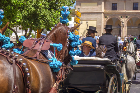 MALAGA, SPAIN - AUGUST, 14: Horsemen and carriages at the Malaga August Fair on August, 14, 2009 in Malaga, Spain のeditorial素材