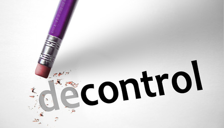 Eraser changing the word decontrol for control の写真素材