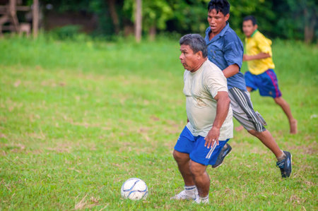 LORETO, PERU - JANUARY 02: Unidentified locals playing football in a small village in the middle of the Amazon Rain Forest, on January 02, 2010 in Loreto, Peru.のeditorial素材