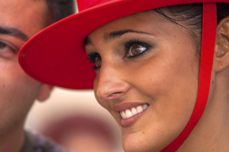MALAGA, SPAIN - AUGUST, 14: A young couple watching people dancing flamenco at the Malaga August Fair on August, 14, 2009 in Malaga, Spainのeditorial素材