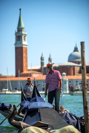 VENICE, ITALY - JULY 12 : Gondolier plying his trade in Venice Italy on July 12, 2014のeditorial素材