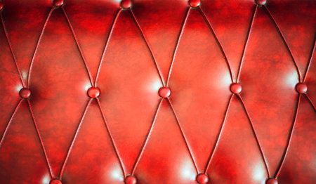 Luxury red leather cushion close-up background