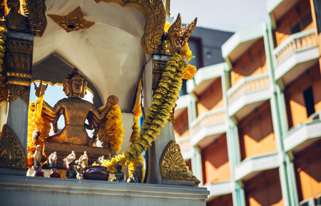 Phra Phrom altar in Bangkok street. Phra Phrom is the Thai representation of the Hindu god Brahmaの写真素材