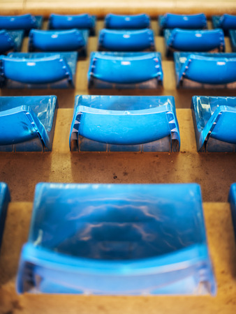Empty Plastic Chairs at the Stadiumの写真素材