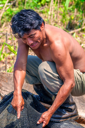 LORETO, PERU - JANUARY 02: Unidentified locals fishing in the river in the middle of the Amazon Rain Forest, on January 02, 2010 in Loreto, Peru.のeditorial素材