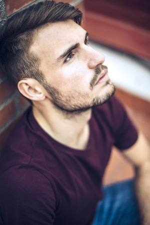 Handsome caucasian young man in casual clothes in urban environmentの写真素材