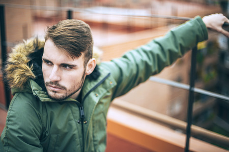 Handsome caucasian young man in casual clothes in urban environmentの写真素材